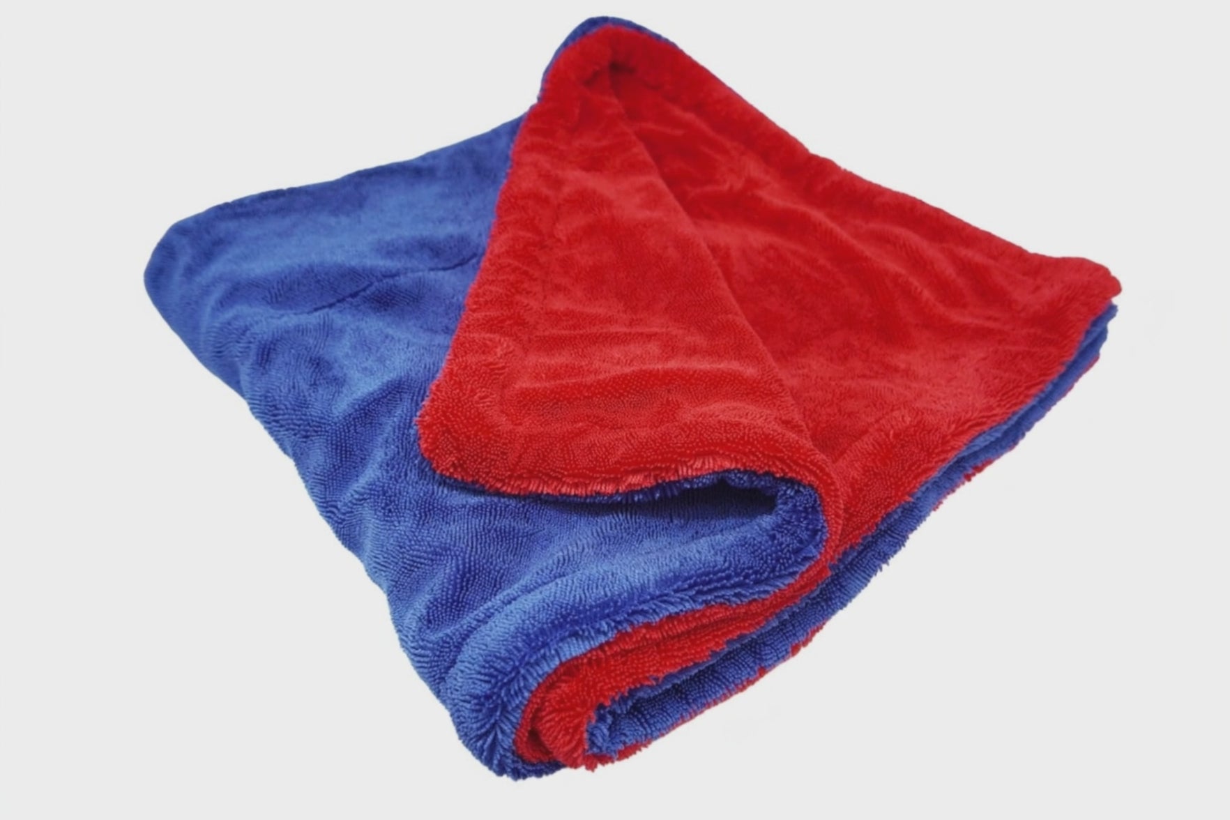 Water droplets absorbing instantly into the Patriot Premium Drying Towel